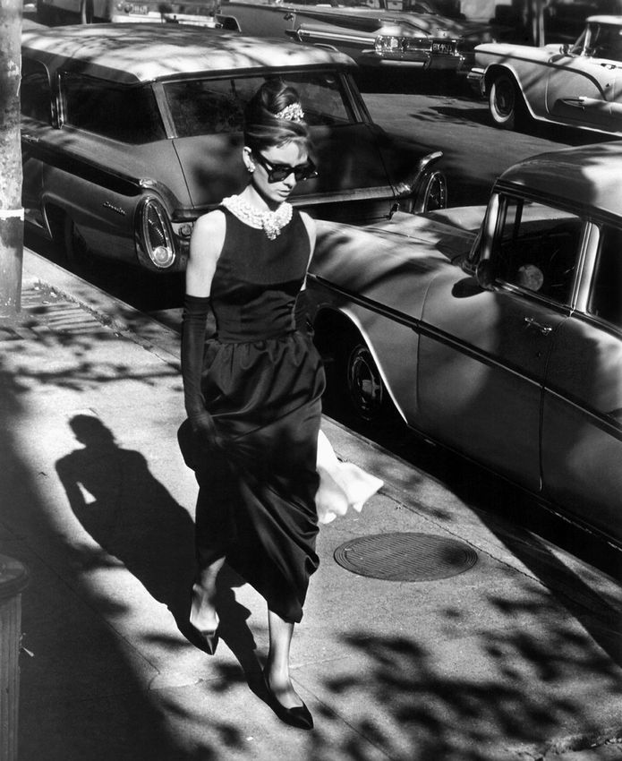 Image of Audrey Hepburn checking a bag